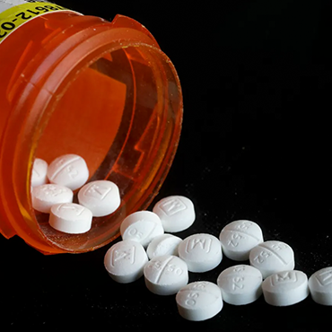 Pills Spilling out of Bottle