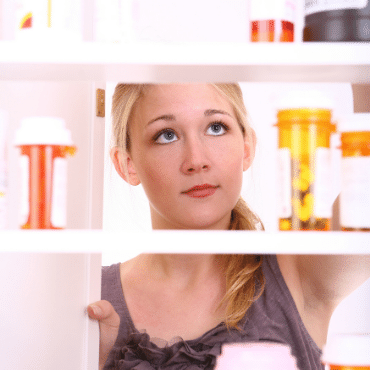 Teenager Looking in Medicine Cabinet