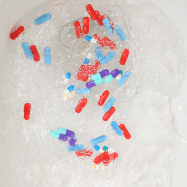 Pills Being Flushed Down the Toilet