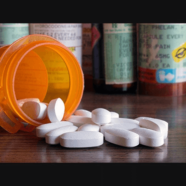 Pills spilling out of bottle